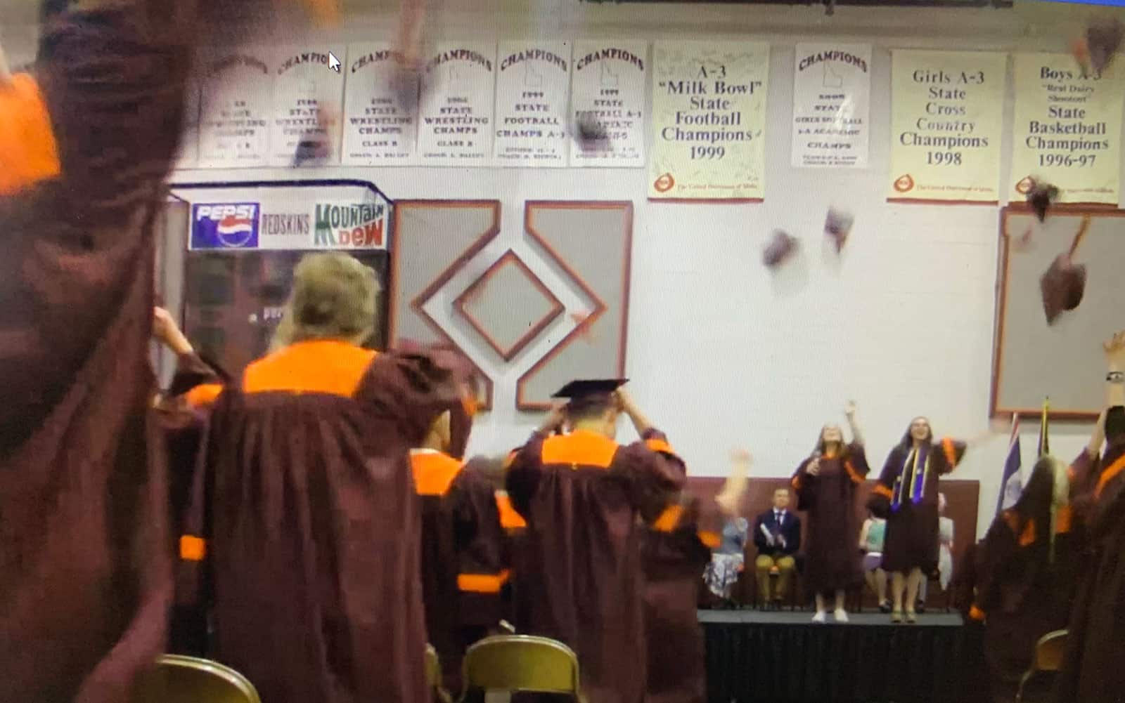 teton high school graduates throwing hats into air